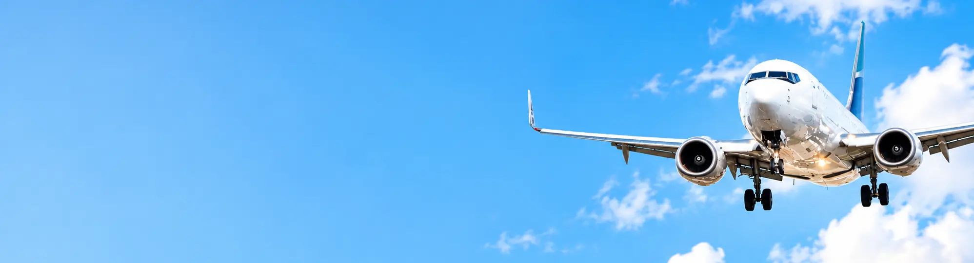 Passenger airplane flying above clouds